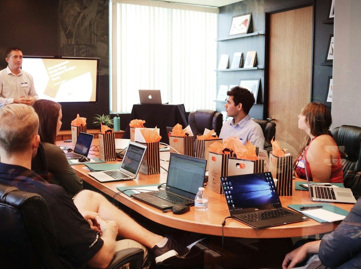 Senior software engineering team collaborating at modern workstations for Missouri technology initiatives