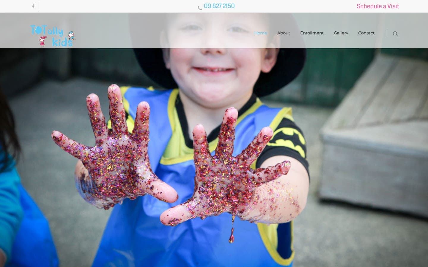 Homepage of the Totally Kids website, showing a real photo of a child at the centre and navigation for the toddlers and transition to school programmes